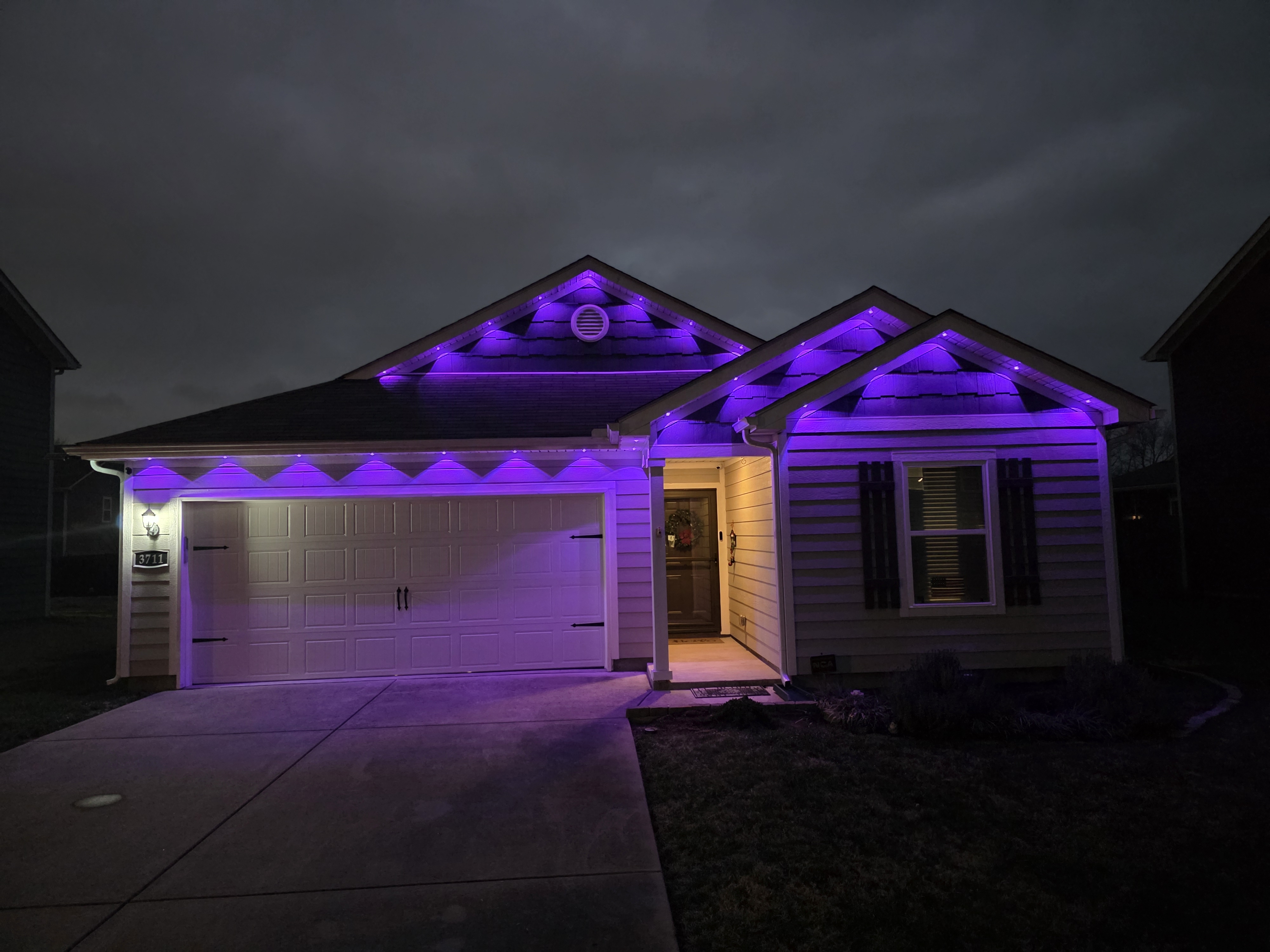 House with blue LED outdoor lighting installation