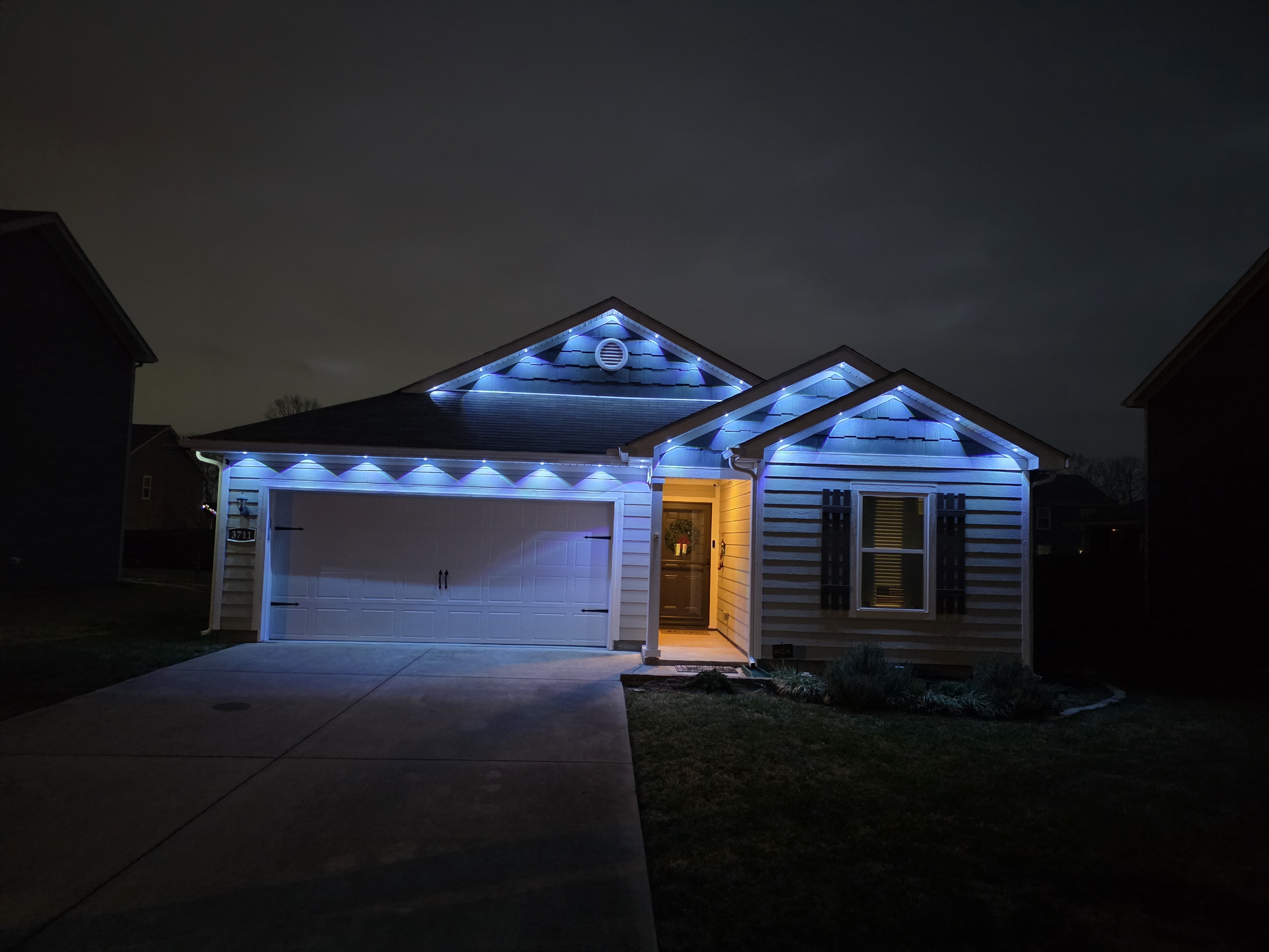 House with purple LED outdoor lighting installation